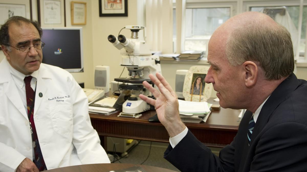 Congressman Keating talking to a doctor.